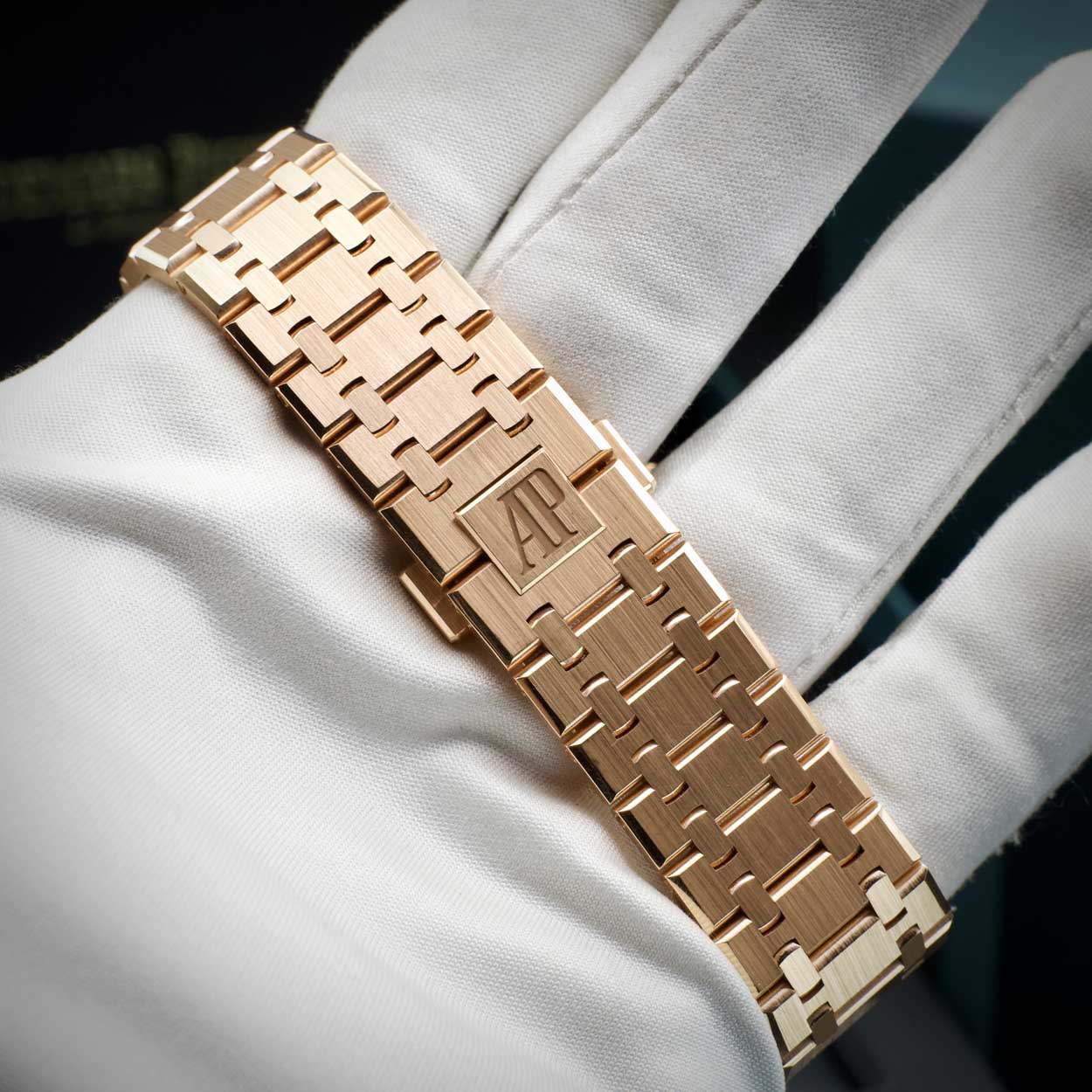 Rose gold watch strap for Audemars Piguet on a white glove